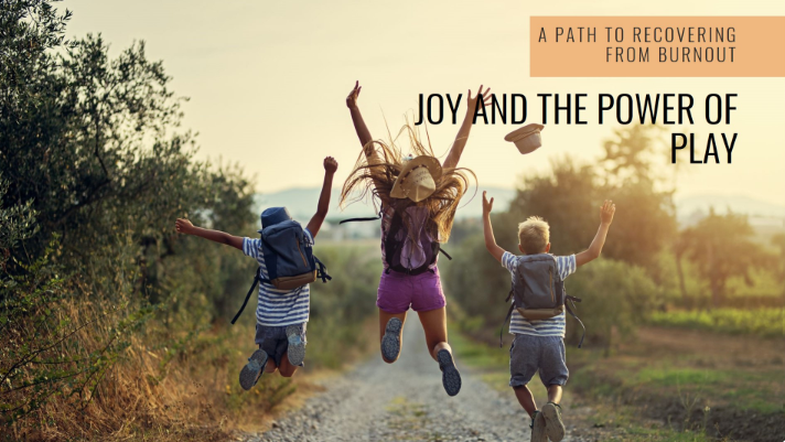 Three kids jumping for joy as they walk down a path